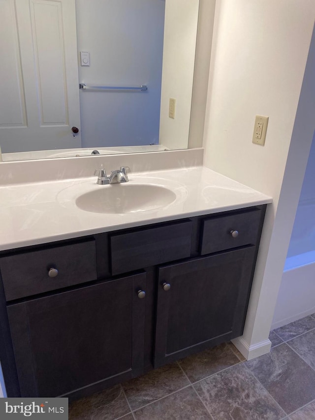 bathroom featuring tile patterned floors and vanity