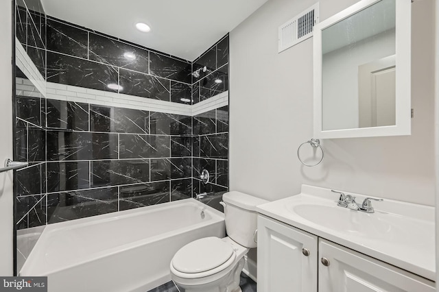 full bathroom with visible vents, shower / washtub combination, toilet, and vanity