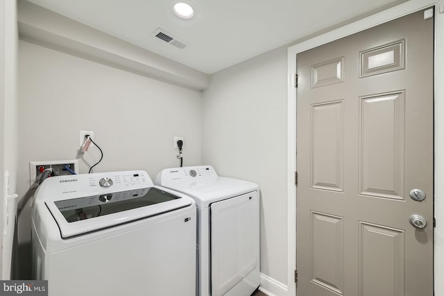 washroom with washer and clothes dryer, laundry area, recessed lighting, and visible vents