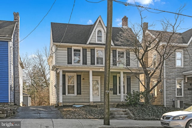 view of front of home with central air condition unit and covered porch