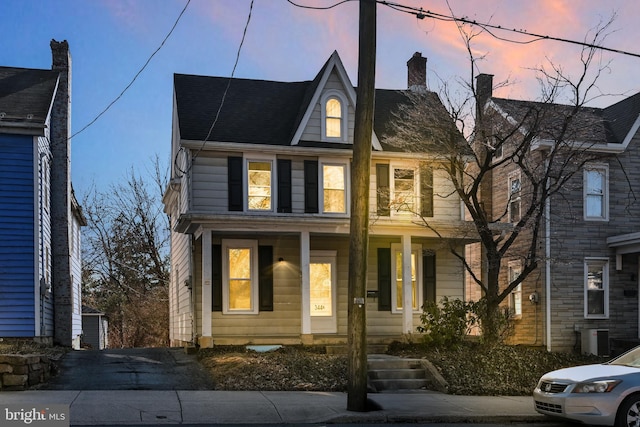 view of front of house featuring central AC unit and covered porch