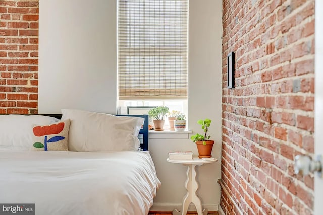 bedroom with brick wall