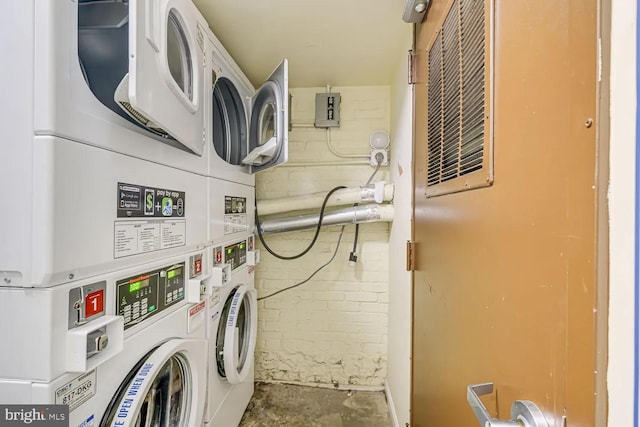 community laundry room with independent washer and dryer and stacked washer and clothes dryer