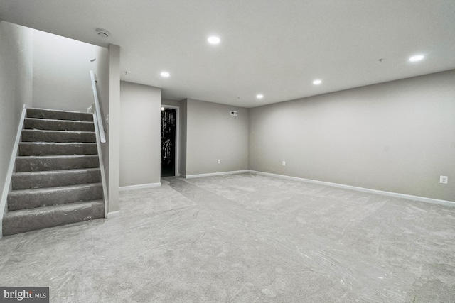 finished below grade area featuring recessed lighting, stairway, baseboards, and carpet flooring