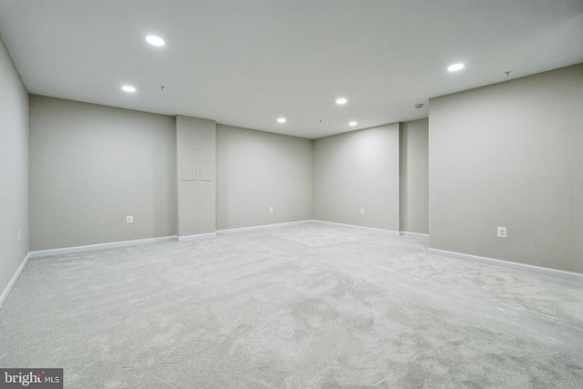 empty room featuring recessed lighting, baseboards, and carpet floors