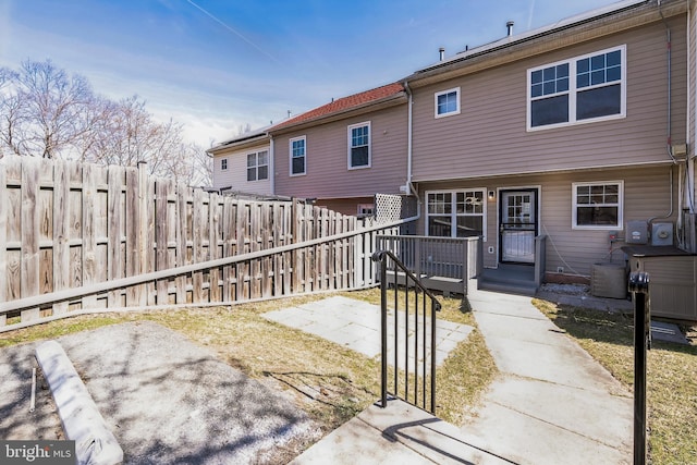 back of house featuring a patio and fence