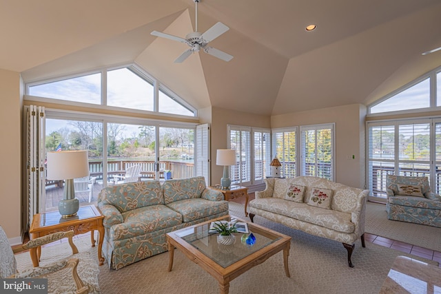 living room featuring tile patterned floors, plenty of natural light, recessed lighting, and lofted ceiling