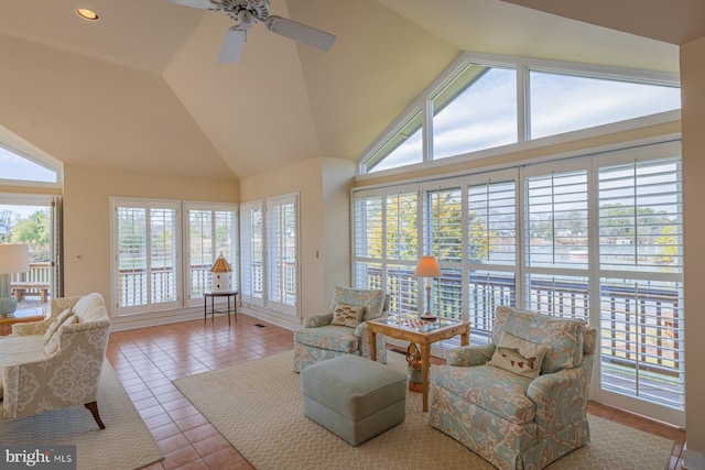 sunroom / solarium with lofted ceiling and ceiling fan