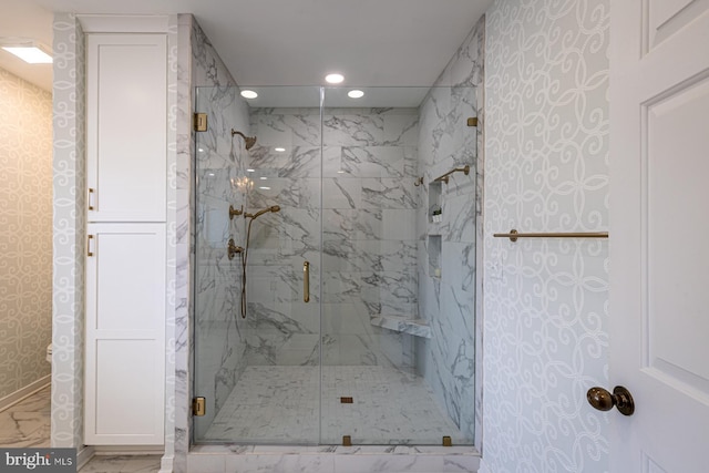 bathroom with recessed lighting, marble finish floor, and a marble finish shower