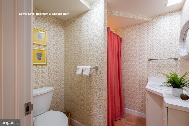 full bathroom featuring vanity, baseboards, wallpapered walls, tile patterned flooring, and toilet