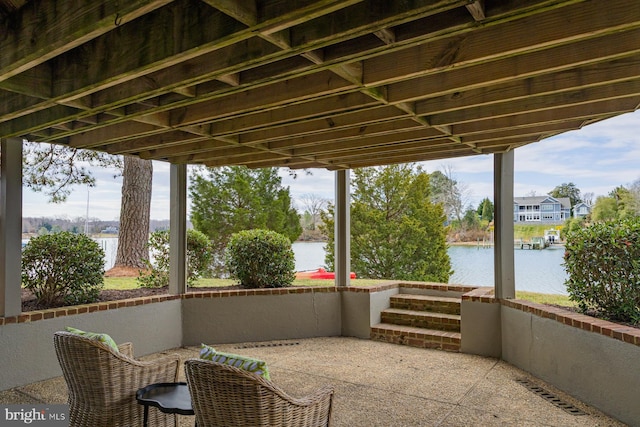 view of patio with visible vents and a water view