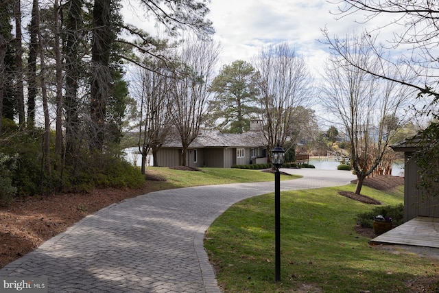 exterior space featuring decorative driveway