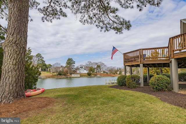 view of yard featuring a deck with water view