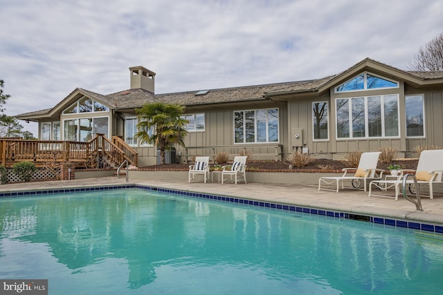 view of swimming pool with a fenced in pool, a deck, and a patio area