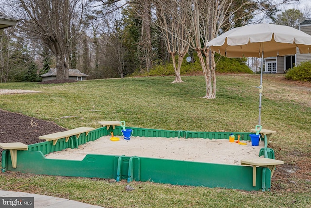 exterior space featuring a playground and a yard