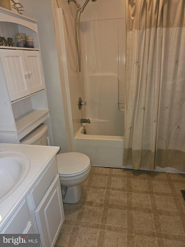 full bath with vanity, toilet, and shower / tub combo