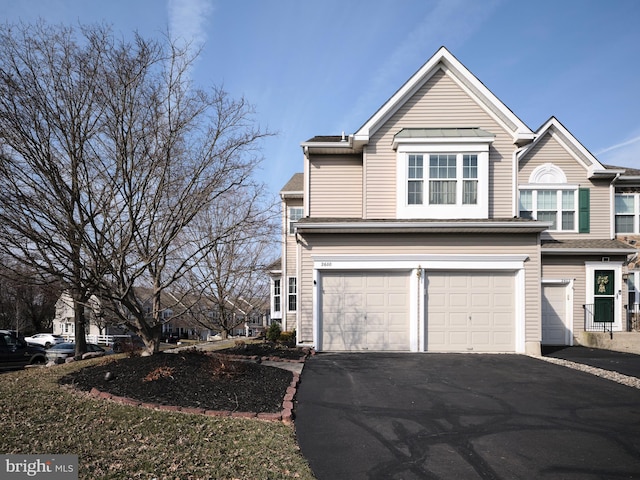 view of front of home featuring an attached garage and driveway