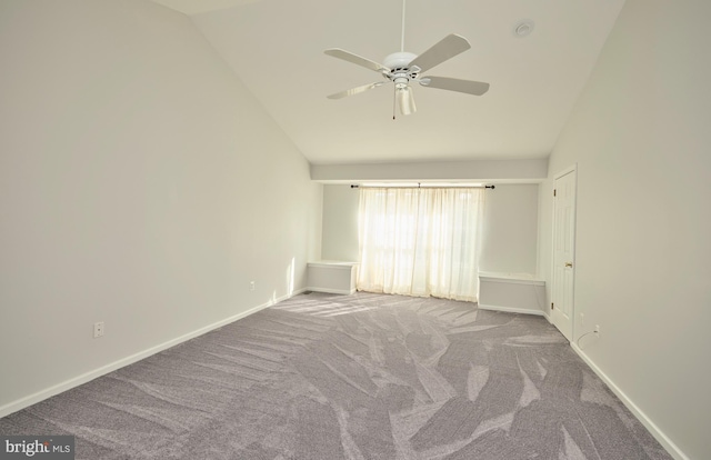 empty room with baseboards, carpet, ceiling fan, and high vaulted ceiling