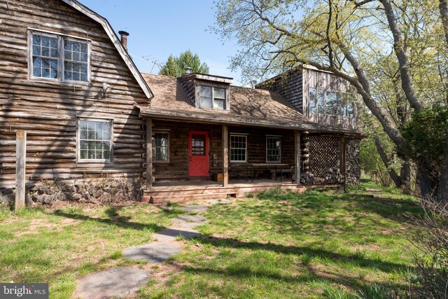 64 Harlingen Rd, Belle Mead, NJ 08502 - log-style house with a chimney, log exterior, and a front lawn