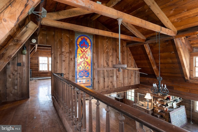 64 Harlingen Rd, Belle Mead, NJ 08502 - hallway with a notable chandelier, lofted ceiling with beams, wood walls, hardwood / wood-style floors, and wood ceiling