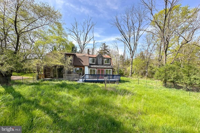 64 Harlingen Rd, Belle Mead, NJ 08502 - back of property with a deck, a chimney, and a gambrel roof