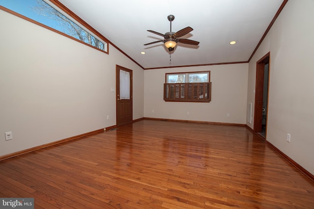 unfurnished room featuring ceiling fan, baseboards, light wood-style flooring, and ornamental molding