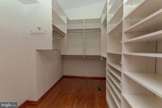 walk in closet featuring wood finished floors and visible vents