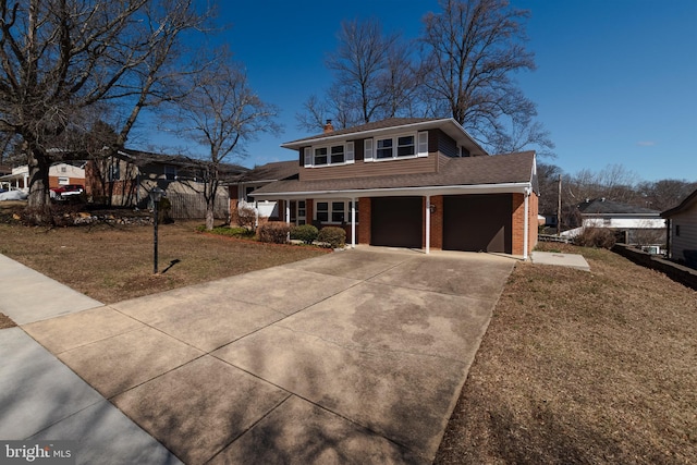 view of front of property with concrete driveway, an attached garage, a front yard, brick siding, and a chimney