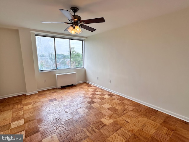 6621 Wakefield Dr Unit 403, Alexandria, VA 22307 - empty room with radiator heating unit, ceiling fan, and baseboards