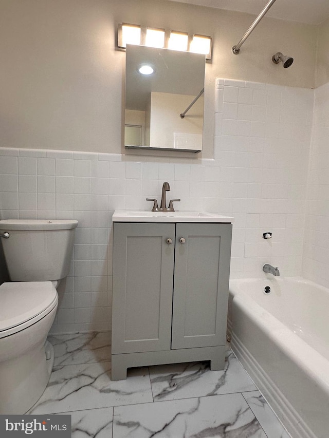 6621 Wakefield Dr Unit 403, Alexandria, VA 22307 - bathroom featuring tub / shower combination, vanity, tile walls, toilet, and marble finish flooring