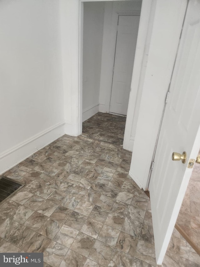 interior space featuring visible vents, baseboards, and a closet