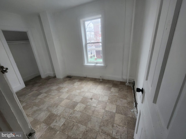 unfurnished bedroom featuring baseboards