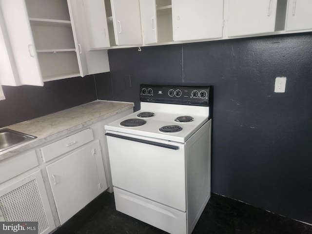 kitchen featuring white cabinetry, open shelves, white electric range, and light countertops