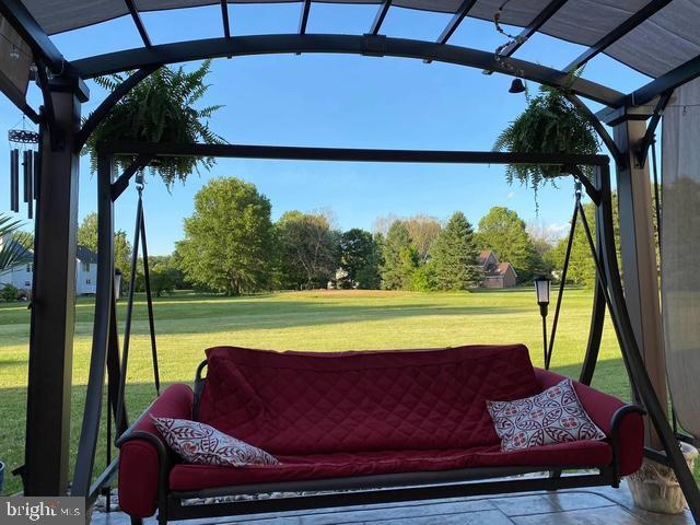 view of patio with a lanai