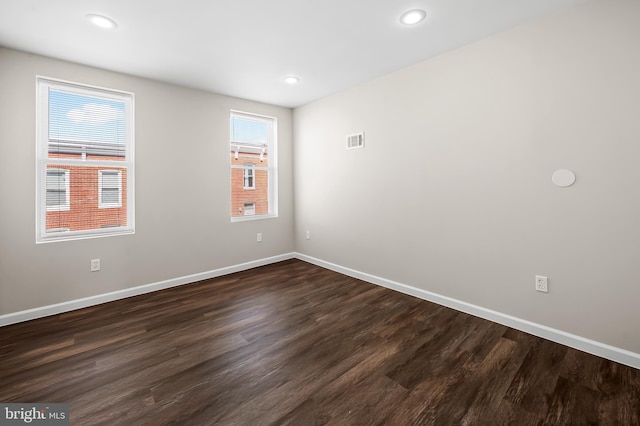 445 Pitman Pl, Baltimore, MD 21202 - spare room with visible vents, baseboards, and dark wood-style floors
