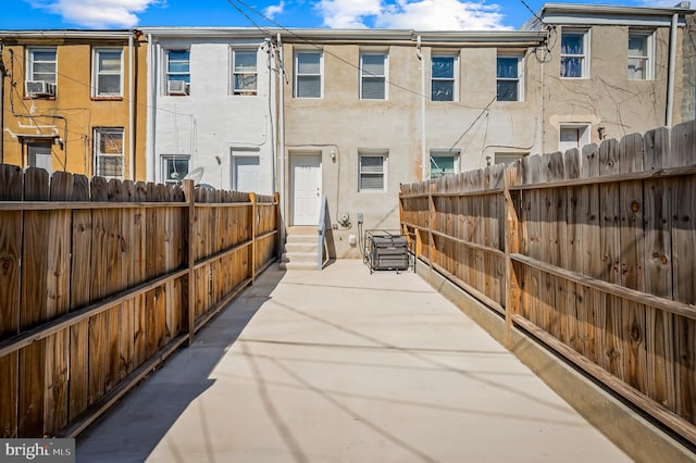 view of patio / terrace with entry steps and fence