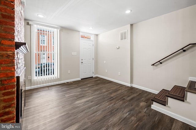 foyer entrance with recessed lighting, visible vents, baseboards, and wood finished floors