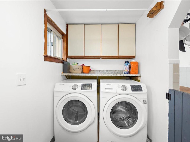 laundry room with cabinet space and independent washer and dryer