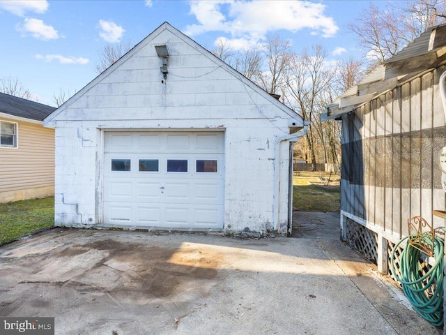 detached garage featuring driveway