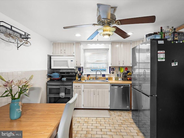 kitchen with recessed lighting, ceiling fan, a sink, light countertops, and appliances with stainless steel finishes