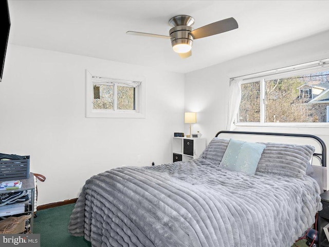 bedroom featuring carpet, baseboards, and ceiling fan