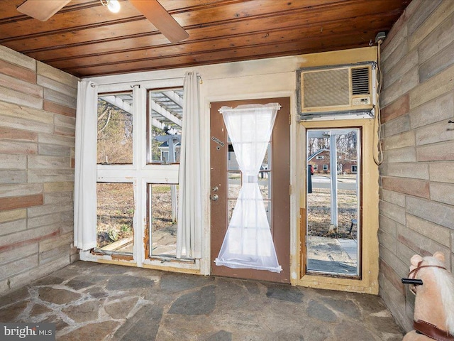 entryway with wooden ceiling and an AC wall unit