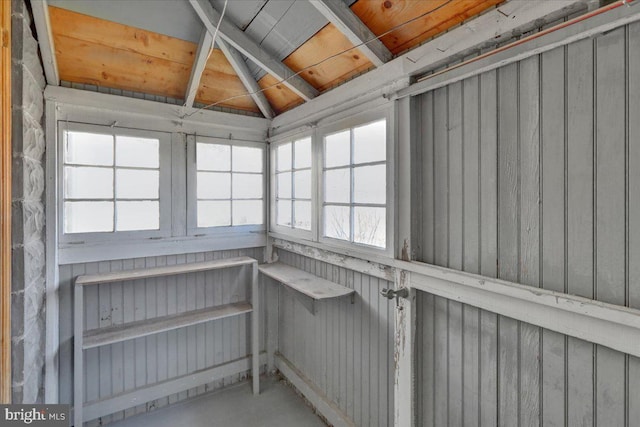 unfurnished sunroom with lofted ceiling