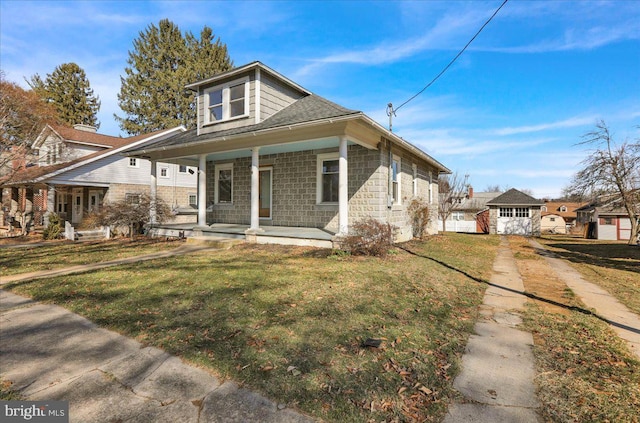 bungalow-style house with a porch and a front yard