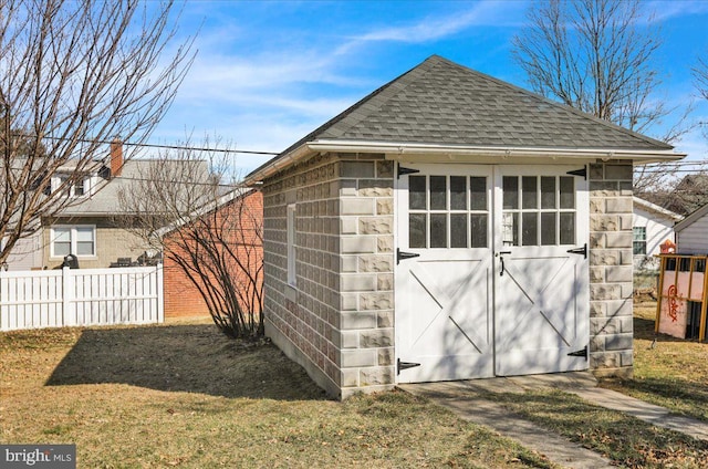 view of shed with fence