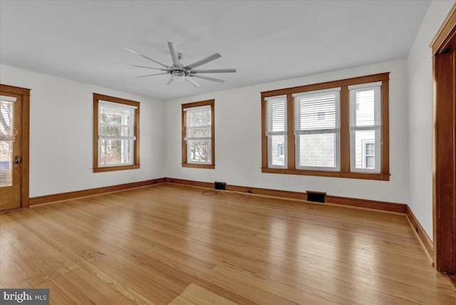 unfurnished living room featuring visible vents, ceiling fan, baseboards, and light wood-style floors