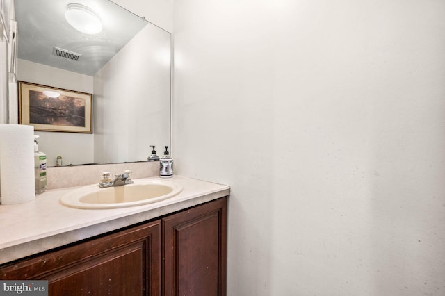 bathroom featuring visible vents and vanity