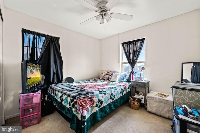 carpeted bedroom featuring ceiling fan