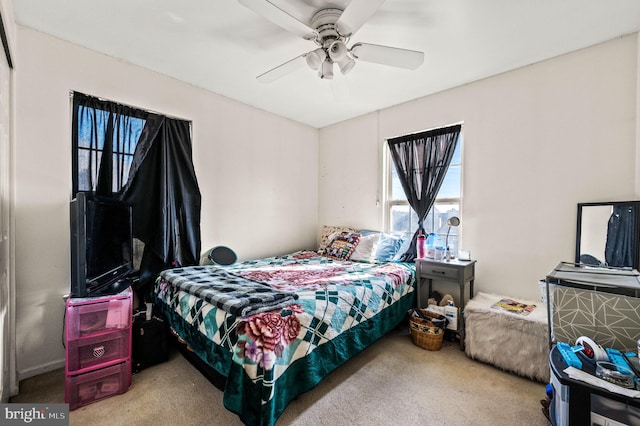 bedroom with a ceiling fan and carpet floors