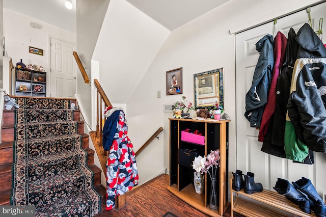 staircase featuring wood finished floors